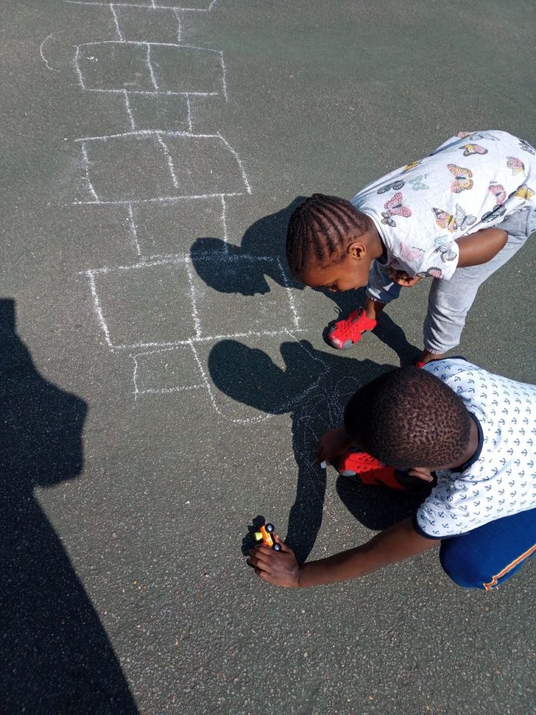 yvonne's children play, communicate and understand his sibling