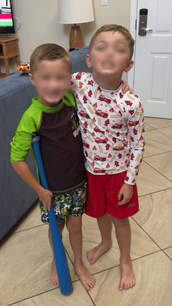 Ashely's children smiling together ready for play in a swimwear