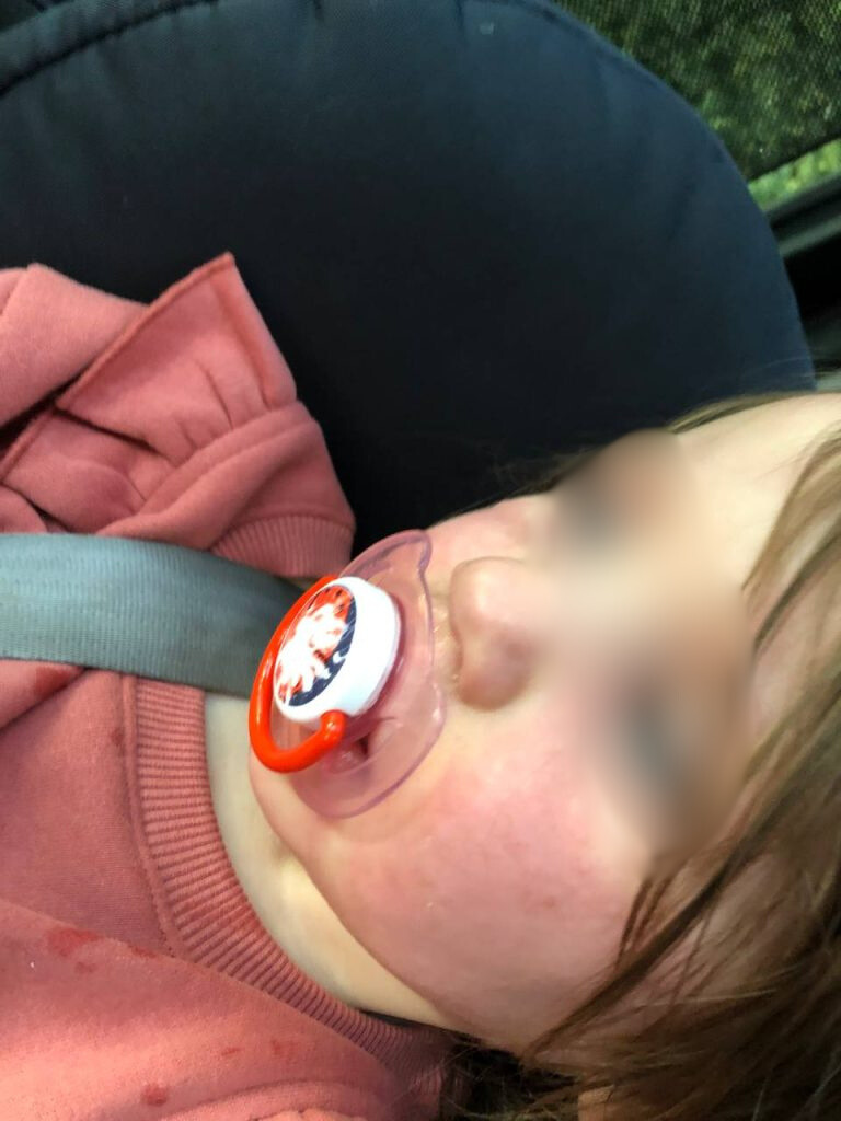 A child with a pacifier.