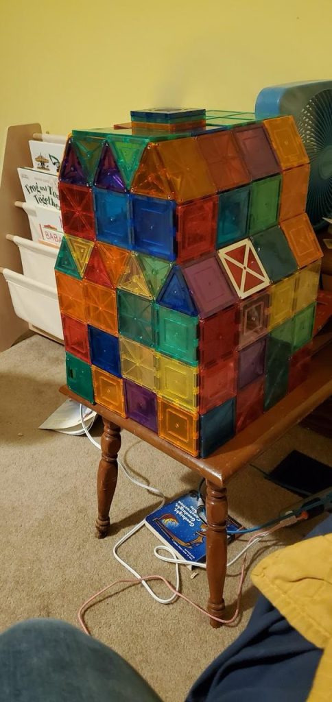 An image of a tower toy with colorful tiles.