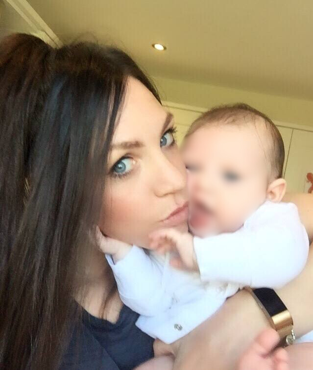 A mom who kisses her happy child
